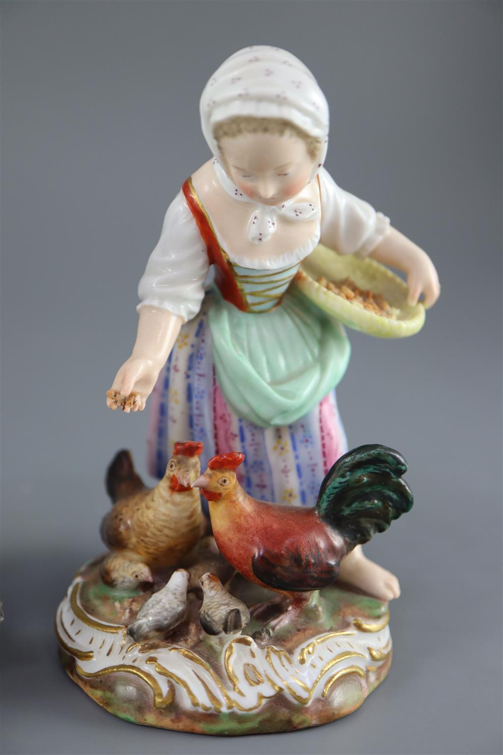 A pair of Meissen figures after the 18th century models of children feeding geese and chickens, 19th century, 12cm and 13cm high